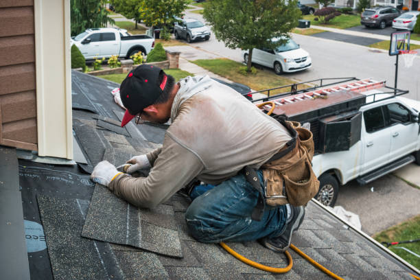 Professional Roofing technician working in East Branch, NY